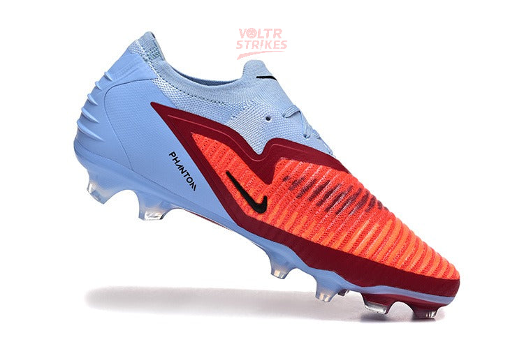 Phantom GX III Elite FG – Bleu Clair & Rouge Solaire