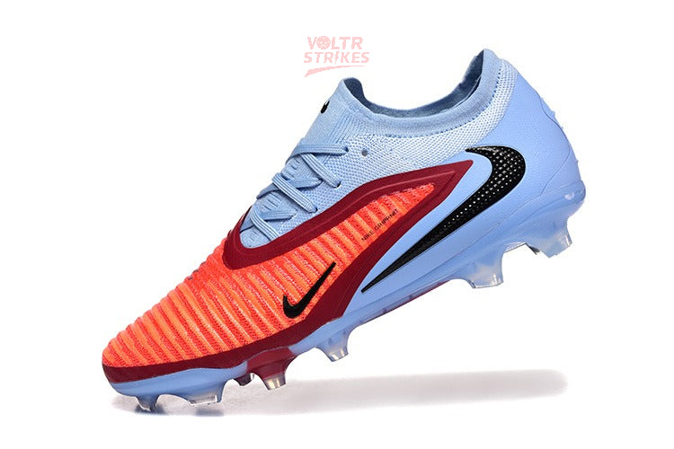 Phantom GX III Elite FG – Bleu Clair & Rouge Solaire